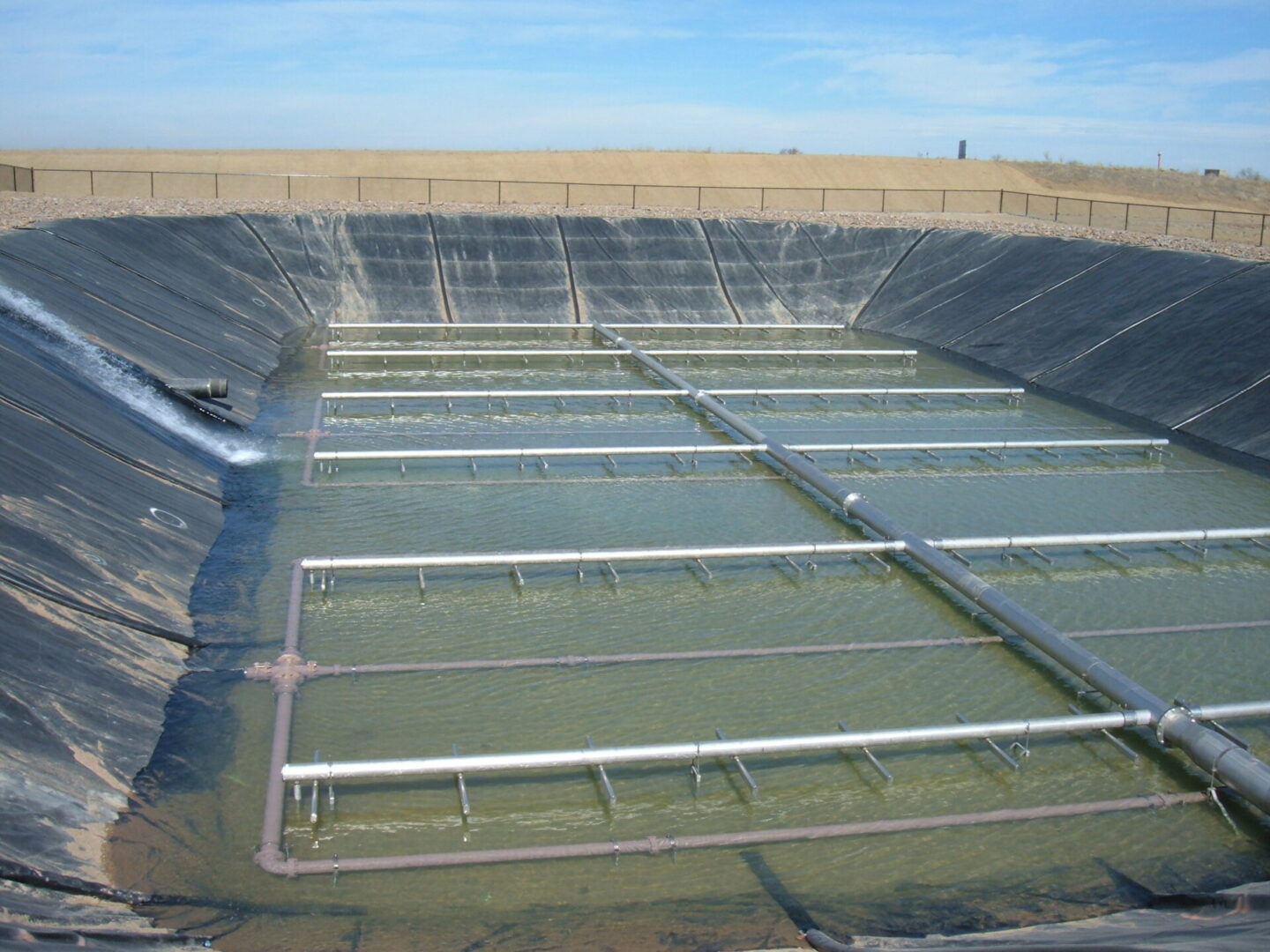 A large pool of water in the middle of an area.