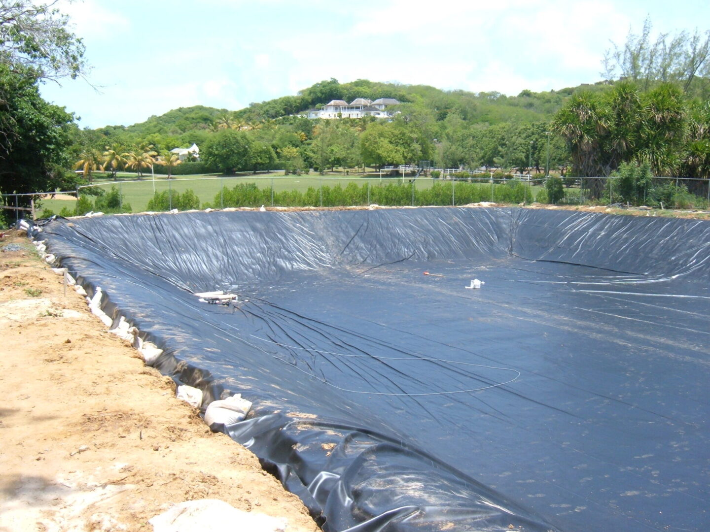 A large black tarp covering the ground.