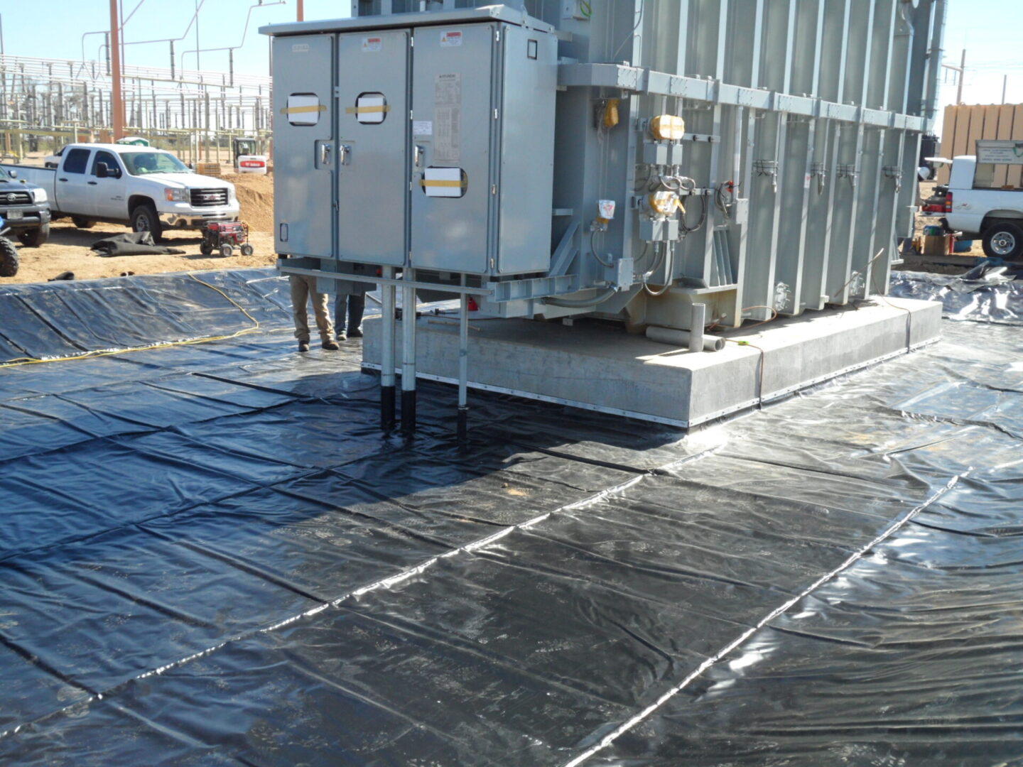 A man standing next to an electrical box.