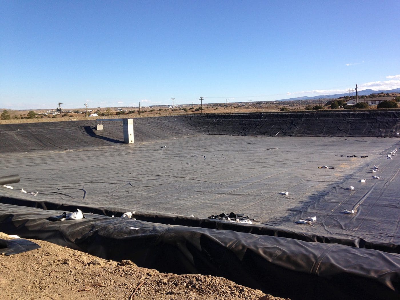 A large concrete slab with a few pipes in it.