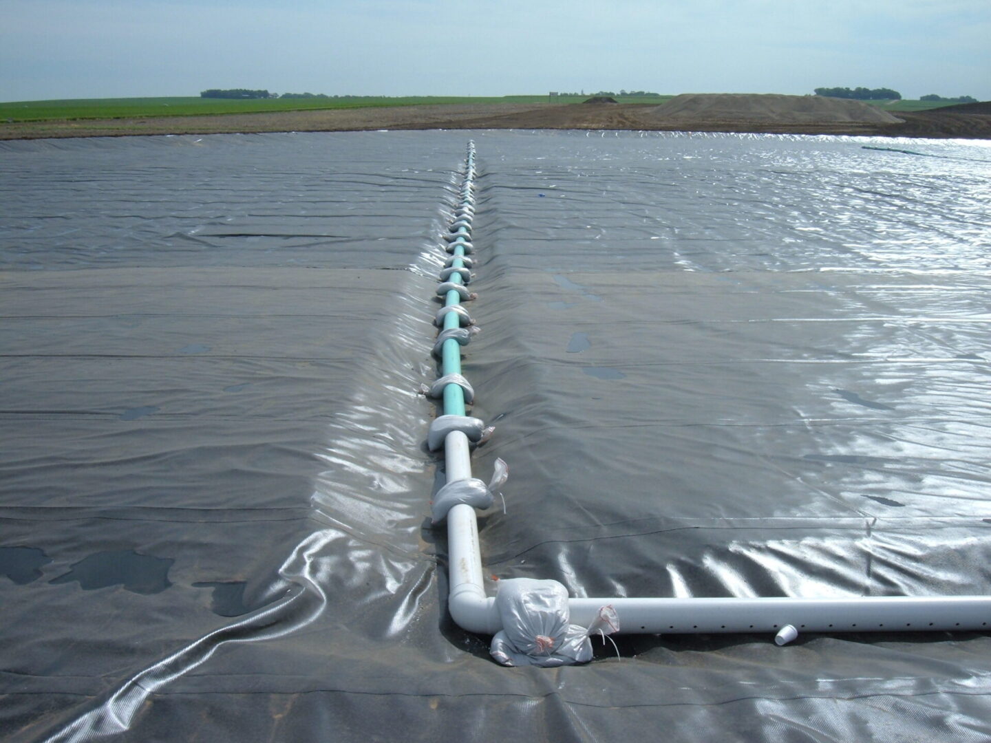 A pipe is connected to the water surface.