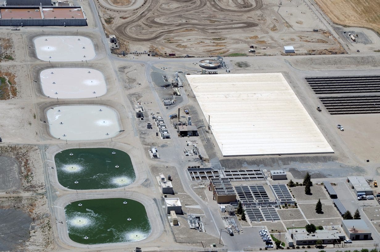 A view of an industrial area with many water tanks.