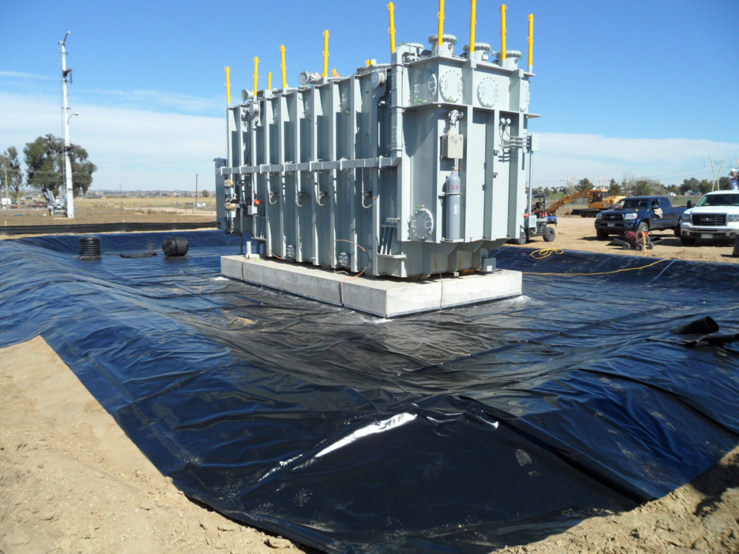 A large concrete structure sitting on top of a field.